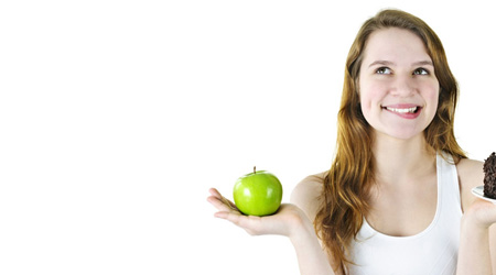 Eating fewer hotdogs and more fresh fruits and vegetables can help you prevent cancer.